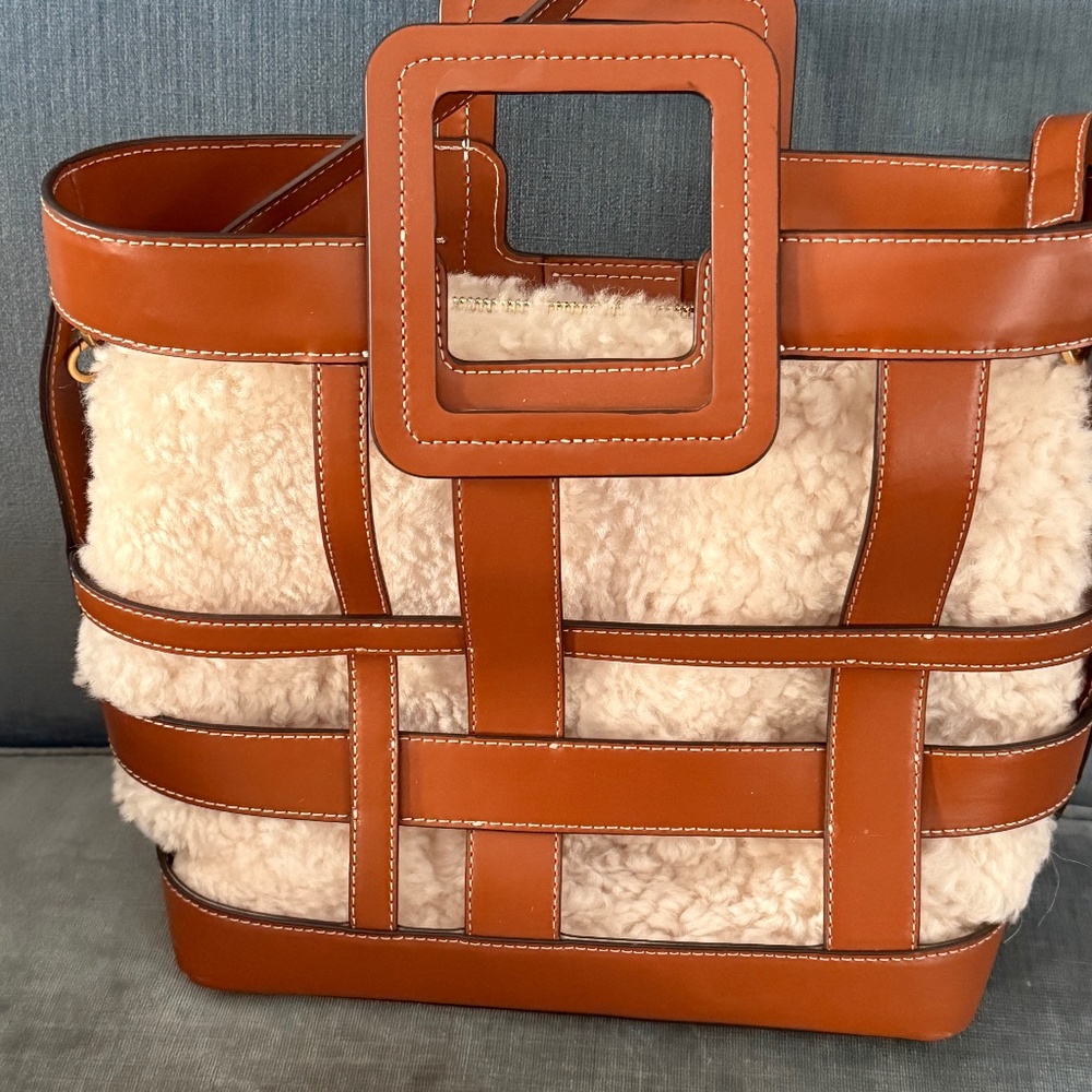 Staud Shearling bag with leather frame.